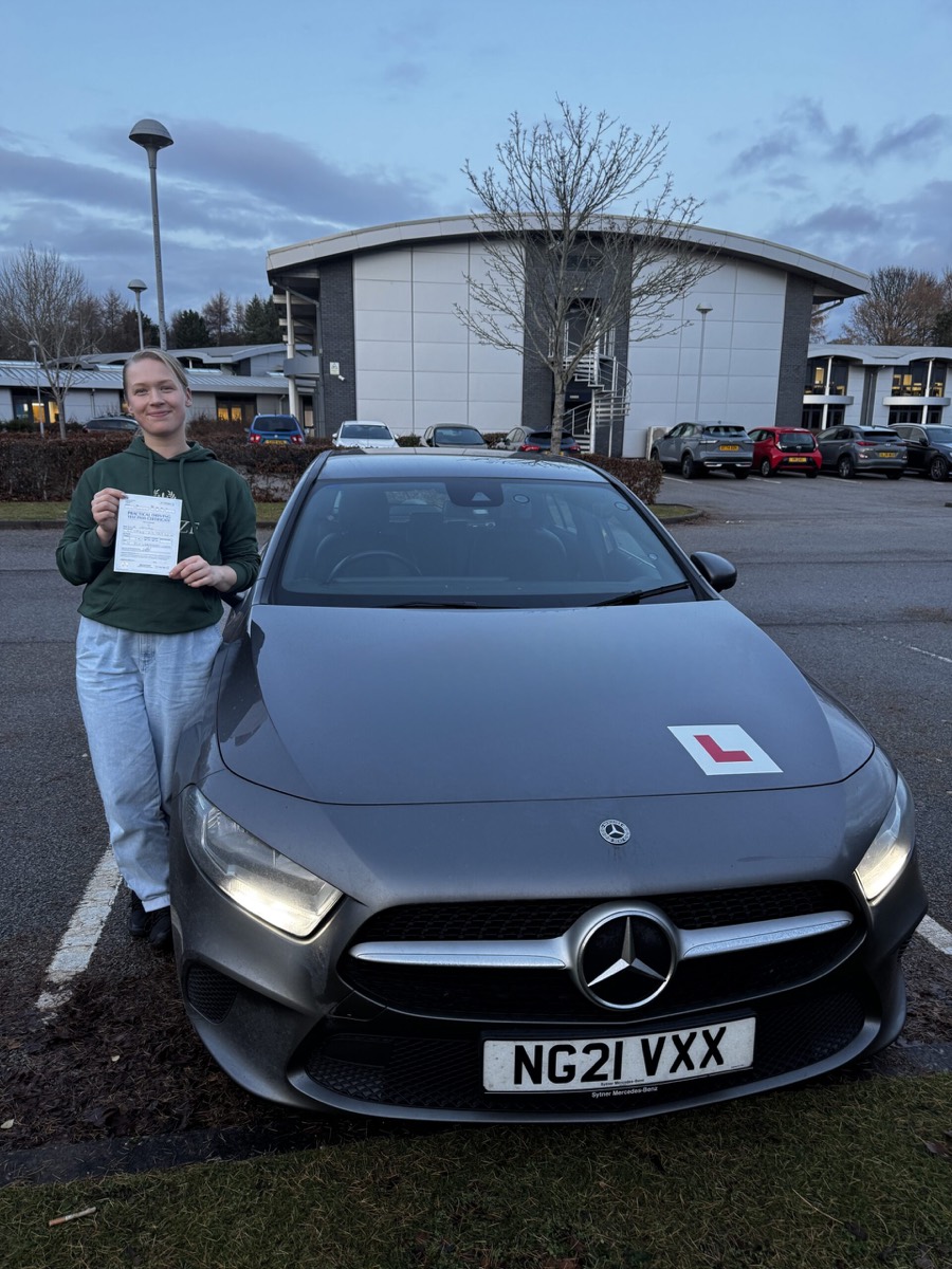 Blue Drive pupil celebrating a pass with the training car